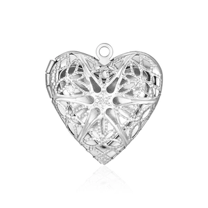 Detailed view of heart-shaped stainless steel locket with intricate lace pattern