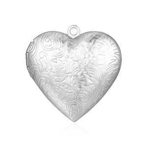 Detailed close-up of a silver heart-shaped locket with engraved floral and vine patterns