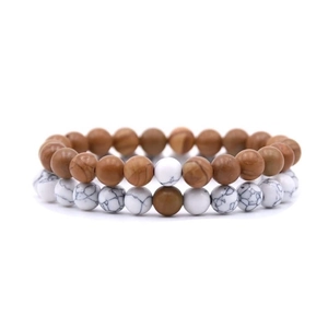 Close-up of 8mm natural stone beaded bracelets showing brown and white marble textures