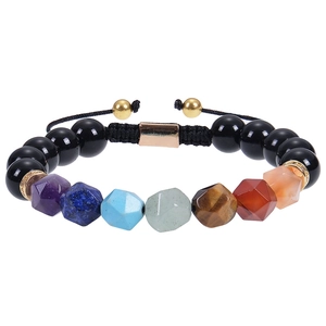 Macro shot of 10mm tiger eye chakra beaded bracelet with adjustable woven cord