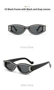 Détail de lunettes de soleil œil de chat ovales avec strass et verres gris foncé