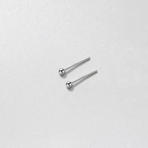 Detailed close-up showing S925 sterling silver stamp on minimalist round ball stud earrings