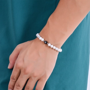 Minimalist white turquoise beaded bracelet with letter A charm and silver metal accents