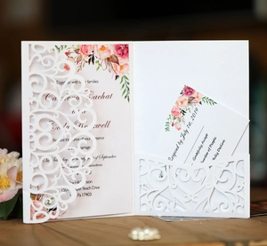 Elegant laser-cut floral wedding invitation set with RSVP card and floral card