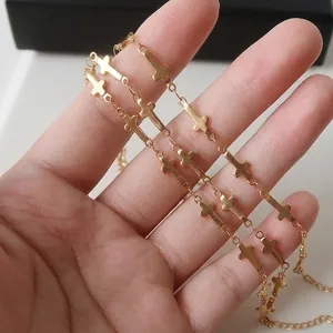 Gold plated stainless steel choker necklace featuring delicate cross charms for women