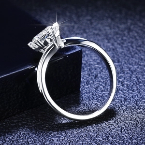 Macro side view of a radiant cut moissanite engagement ring with four-prong S925 silver setting