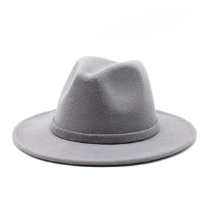 Detailed texture of gray felt western cowboy hat with matching decorative trim