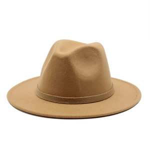 Detailed close-up of a camel wool felt fedora hat featuring a matching decorative band