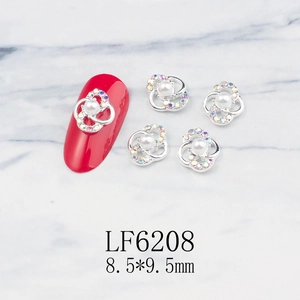 Close-up of alloy flower nail art charms with pearls and rhinestones size 8.5x9.5mm
