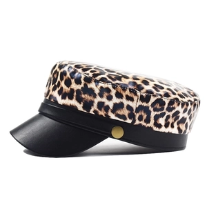 Leopard print flat top army cap with black leather brim and gold button detail