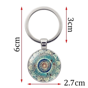 Flower of Life Mandala glass keychain with dimensions 6cm x 3cm in blue tones