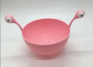 Pink cartoon monster pasta strainer bowl with unique dual eye-handle design