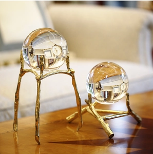 Detail of crystal ball set with brass branch base for luxury Nordic home decoration