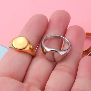 Polished stainless steel oval signet ring in gold and silver finish for women