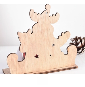 Rear view of laser-cut wooden Christmas advent calendar with star patterns and reindeer shape