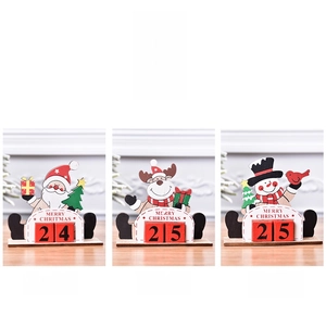 Detailed view of three painted wooden Christmas countdown calendars with snowman and reindeer
