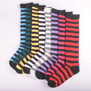 Set of eight colorful striped knee-high socks in vibrant cotton blend for women