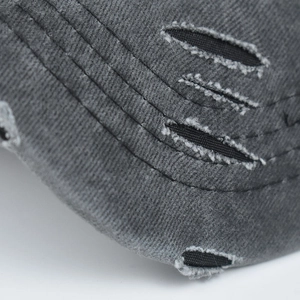 Detail of distressed grey ponytail baseball cap with vintage washed fabric and stitching