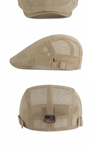Detail of breathable mesh beret featuring adjustable side buckle and rear logo label