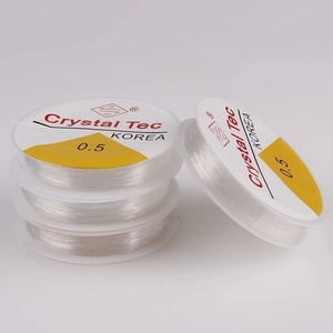 Detailed close-up of 0.5mm clear elastic crystal cord for DIY jewelry making and beading