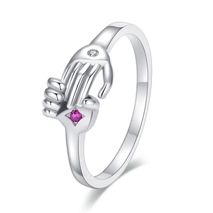 Detail of silver hugging ring featuring a purple gemstone and sparkling white zircon accents