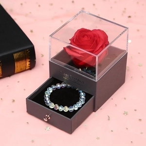 Rose jewelry gift box with drawer and crystal bead bracelet on star pattern background