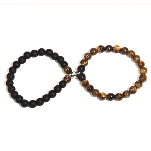 Magnetic couple bracelets set featuring black matte beads and brown tiger eye stones