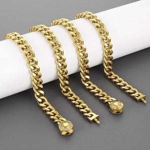 Men's gold plated Cuban link necklaces with CNC diamond clasps on a cylinder base