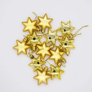 Set of 12 gold star Christmas tree ornaments with hanging strings on white background