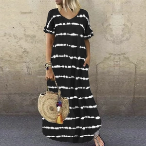 Detail of V-neck maxi dress featuring black and white stripes and side pockets