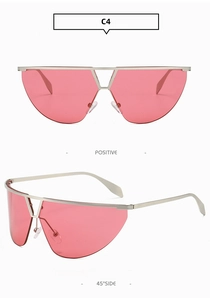 Detailed front and side views of red oversized frameless futuristic silver metal sunglasses