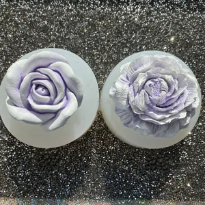 Close-up of detailed rose and peony silicone molds for DIY resin crafts and home decor.