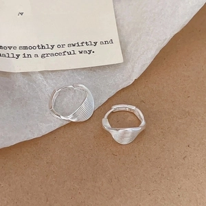 Minimalist S925 sterling silver twist hoop earrings with elegant textured spiral design