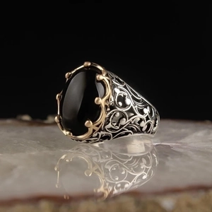 Retro punk men's silver ring with oval black gemstone and golden claw settings