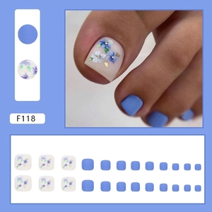 Summer Morandi blue matte press-on toenails with white floral patterns and gold foil flakes