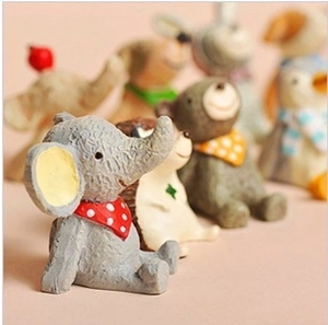 Miniature resin animal figurines featuring elephant, hedgehog, and bear looking at stars