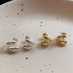 Modern twisted drop stud earrings in gold and silver finish with 925 silver needles