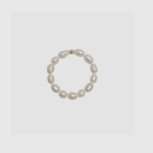 Detailed view of handmade freshwater baroque pearl ring with small metal bead