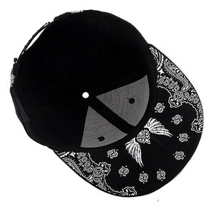 Hip hop flat brim baseball cap featuring black fabric and white paisley wing print