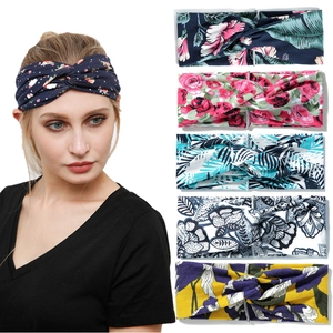 Detail of six printed yoga headbands with knot designs in various floral patterns