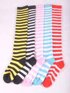 Flat lay detail of striped over-the-knee socks in five vibrant color combinations