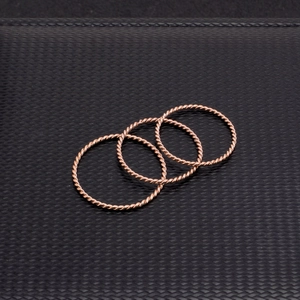 Three-piece set of rose gold stackable twist rings with vintage minimalist rope design