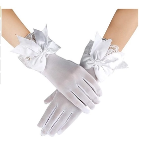 Detail of white bridal lace gloves with a large satin bow and delicate mesh floral pattern