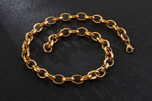 Close-up of polished gold-plated stainless steel O-chain necklace with lobster clasp