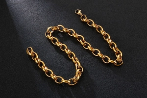 Close-up of golden stainless steel O-chain link necklace with lobster clasp closure