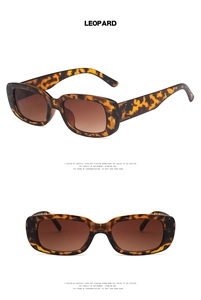 Close-up of leopard print rectangular sunglasses with brown gradient lenses and metal side accents