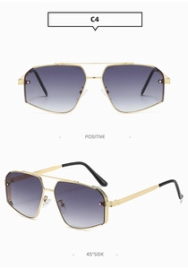 Détail de lunettes aviateur vintage avec monture en métal doré et verres dégradés violets