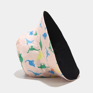 Detailed view of pink cotton bucket hat with colorful dinosaur print and black lining