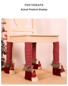 Detail of Christmas gnome chair leg covers with red stripes and faux fur trim decor