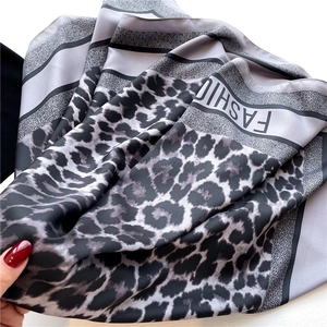 Chic leopard print silk scarf for women in black and gray with fashion border